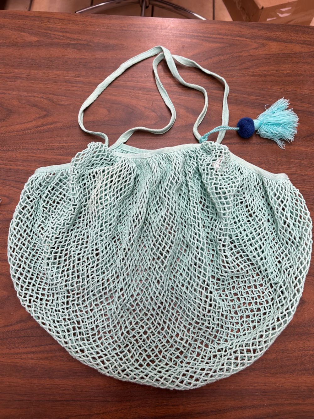 Preowned Mint Green Net Market Bag with Tassel with a small discoloration